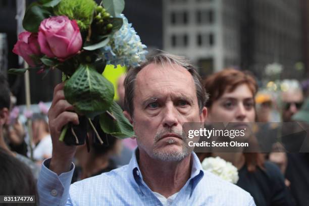 People gather downtown protest the alt-right movement and to mourn the victims of yesterdays rally in Charlottesville, Virginia on August 13, 2017 in...