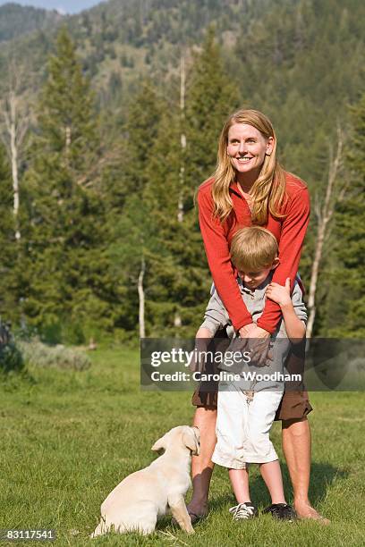 mom playing with son on camping trip in nature. - ketchum idaho stock-fotos und bilder