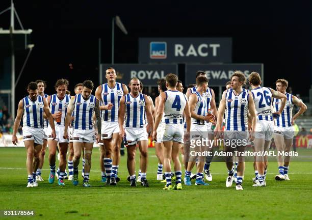 Kangaroos players look dejected after a loss during the 2017 AFL round 21 match between the Hawthorn Hawks and the North Melbourne Kangaroos at the...