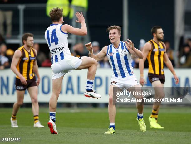 Cameron Zurhaar of the Kangaroos celebrates his first AFL goal with Trent Dumont of the Kangaroos during the 2017 AFL round 21 match between the...