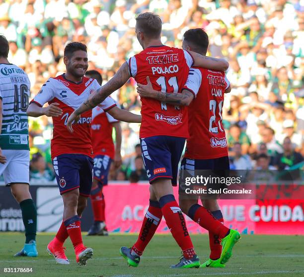 Cristian Menendez of Veracruz celebrates with teammates after scoring the first goal of his team during the 4th round match between Santos Laguna and...