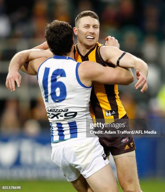 Scott Thompson of the Kangaroos remonstrates with Liam Shiels of the Hawks during the 2017 AFL round 21 match between the Hawthorn Hawks and the...