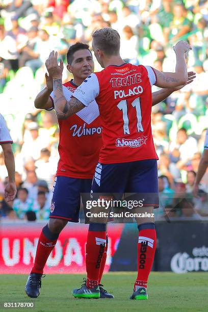 Cristian Menendez of Veracruz celebrates with teammate Adrian Luna after scoring the first goal of his team during the 4th round match between Santos...