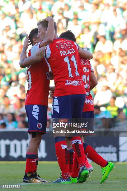 Cristian Menendez of Veracruz celebrates with teammates after scoring the first goal of his team during the 4th round match between Santos Laguna and...