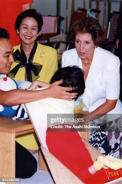 Norma Major, wife of British Prime Minister John Major and Kayoko Hosokawa, wife of Japanese Prime Minister Morihiro Hosokawa visit a school for...