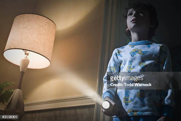 boy with flashlight searching at night - kids room stock pictures, royalty-free photos & images