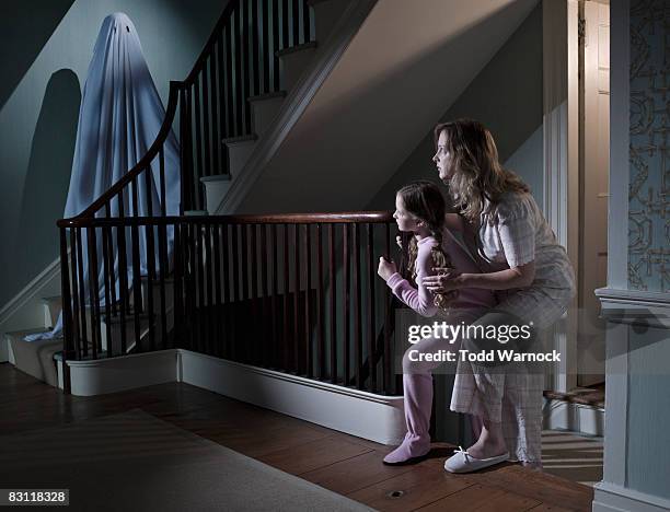 girls following ghost - a haunted house stockfoto's en -beelden