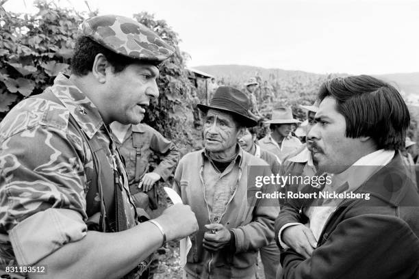 Guatemalan Army officer speaks to local residents about forming civil defense patrols to protect their village, near Huehuetenango, Guatemala, mid...
