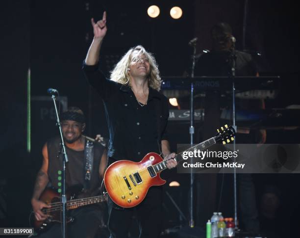 Ethan Farmer and Ben Mauro perform with Lionel Richie at Infinite Energy Arena on August 13, 2017 in Duluth, Georgia.