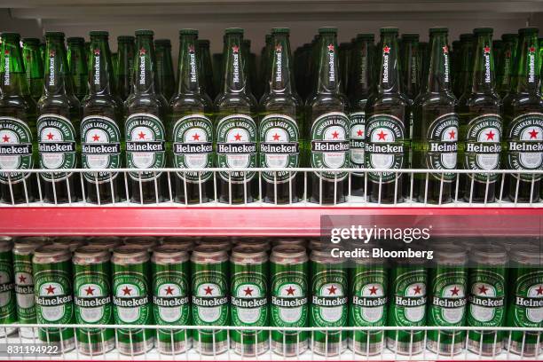 Heineken NV bottles and cans of lager are displayed at a Nomin Holding supermarket in Ulaanbaatar, Mongolia, on Saturday, Aug. 12, 2017. The...