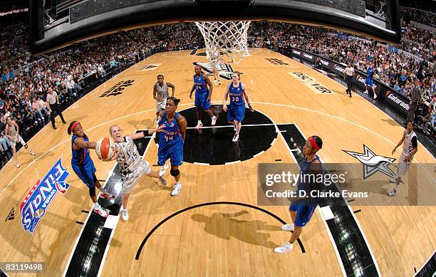 Alexis Hombuckle of the Detroit Shock fouls Becky Hammon of the San Antonio Silver Stars in Game Two of the WNBA Finals on October 3, 2008 at the...