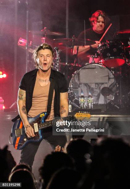 John Rzeznik and Craig Macintyre of the Goo Goo Dolls perform at Northwell Health at Jones Beach Theater on August 13, 2017 in Wantagh, New York.