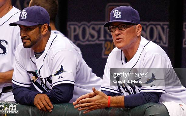 Manager Joe Maddon and bench coach Dave Martinez of the Tampa Bay Rays watch the game from the dugout against the Chicago White Sox in Game 2 of the...