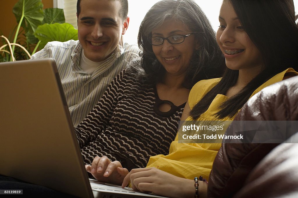 Mom and children using laptop