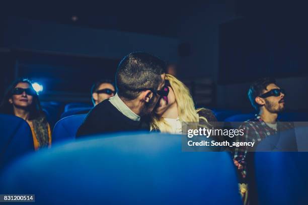 people kissing at the cinema - loving 2016 film stock pictures, royalty-free photos & images