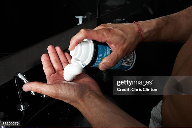 man shaving in modern bathroom - shaving cream stock pictures, royalty-free photos & images