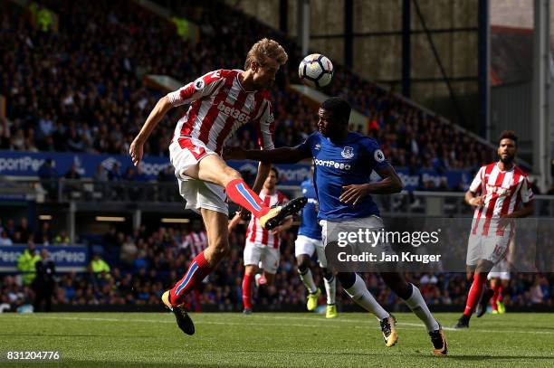 Peter Crouch of Stoke City battles with Cuco Martina of Everton during the Premier League match between Everton and Stoke City at Goodison Park on...