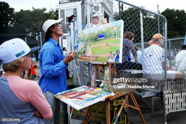 Jim Freeheart paints a scene of game one of the Cape Cod League Championship Series between the Bourne Braves and the Brewster Whitecaps at Stony...