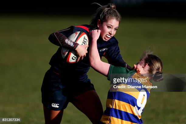 Amy de Plessis of Southland Girls is tackled during the Southland Secondary School Girls Final match between Southland Girls High School v Eastern...