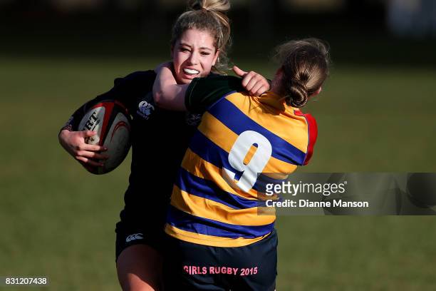 Amy de Plessis of Southland Girls is tackled during the Southland Secondary School Girls Final match between Southland Girls High School v Eastern...