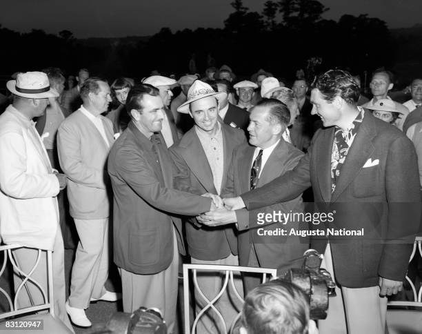 Sam Snead is congratulated by Lloyd Mangrum, Bobby Jones and Johnny Bulla after winning the 1949 Masters Tournament at Augusta National Golf Club on...