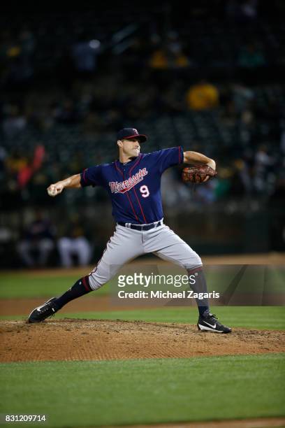 Matt Belisle of the Minnesota Twins pitches during the game against the Oakland Athletics at the Oakland Alameda Coliseum on July 28, 2017 in...