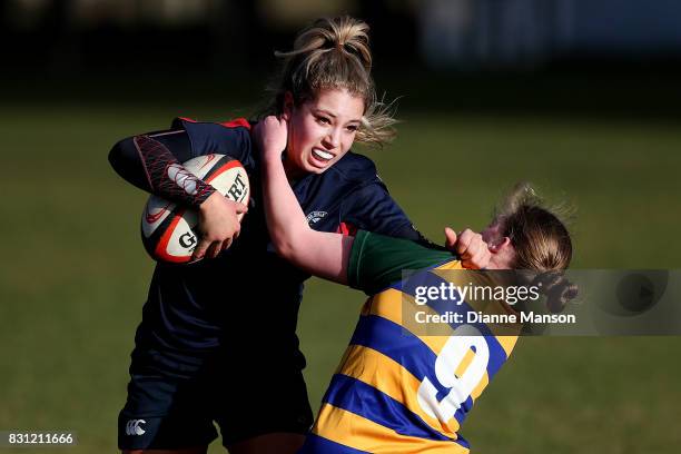 Amy de Plessis of Southland Girls is tackled during the Southland Secondary School Girls Final match between Southland Girls High School v Eastern...