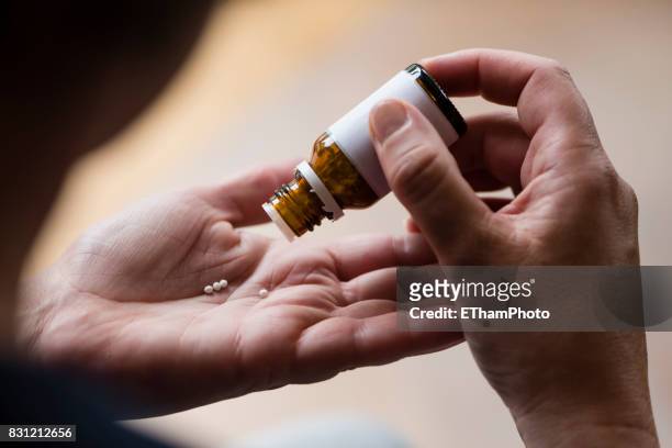 homeopathic pills (globules) - globuli stock-fotos und bilder