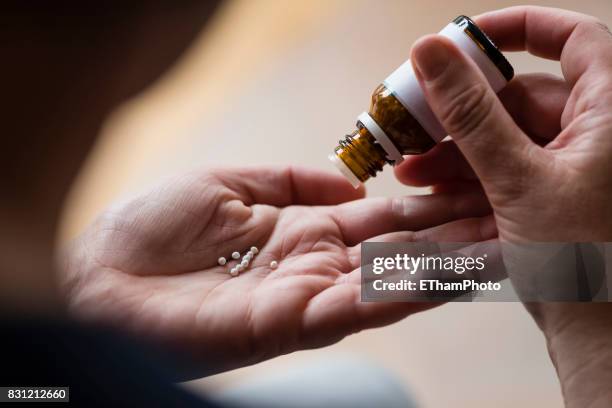 homeopathic pills (globules) - naturopath stock pictures, royalty-free photos & images