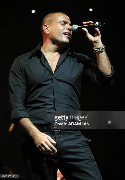 Egyptian singer Amr Diab performs live in concert in Bahrain's capital Manama on October 3 as part of the extended Eid al-Fitr celebrations. AFP...