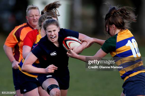 Emma Dermody of Southland Girls High is tackled by Libby Miller of Eastern Girls during the Southland Secondary School Girls Final match between...