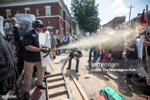 White supremacist groups and counter protestors clash during the Unite the Right rally in Charlottesville, VA, August 12, 2017.