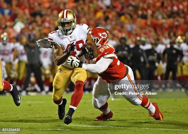 Running back Matt Breida of the San Francisco 49ers rushes against Defender Rakeem Nunez-Roches of the Kansas City Chiefs during the second half of a...