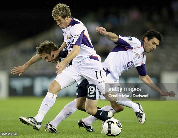 Scott Bulloch of the Glory competes with Evan Berger of the Victory during the round seven A-League match between the Melbourne Victory and the Perth...