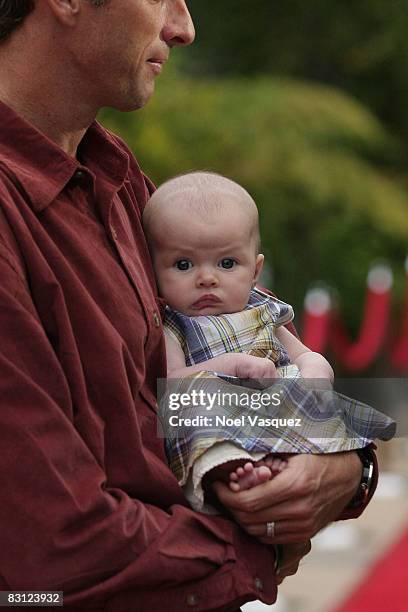 Tony Hawk and his baby daughter Kadence Clover Hawk attend the "Ante Up For Autism" benefit event at the St. Regis Monarch Beach Resort on October 3,...