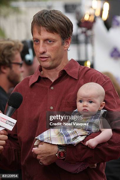 Tony Hawk and his baby daughter Kadence Clover Hawk attend the "Ante Up For Autism" benefit event at the St. Regis Monarch Beach Resort on October 3,...