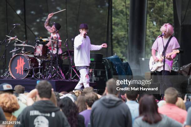 Louis Vecchio, David Boyd and Soren Hansen of New Politics perform on stage during the Summer Camp Music Festival hosted by 107.7 The End at Marymoor...