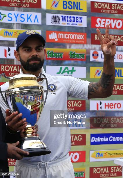 Indian cricket captain Virat Kohli poses with the winners trophy after the 3rd Day's play in the 3rd and final Test match between Sri Lanka and India...