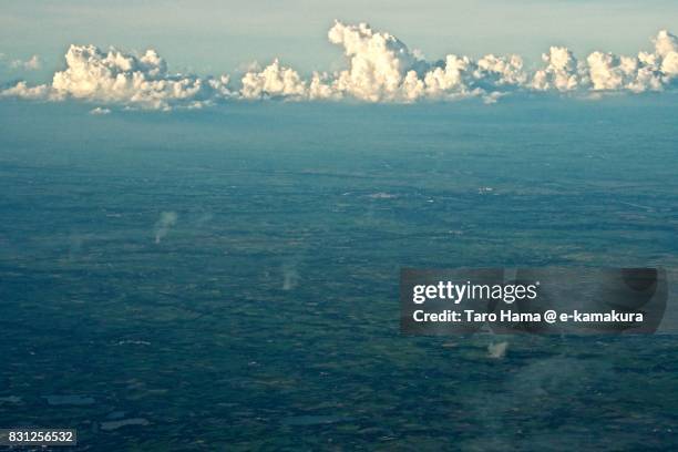 thunder clouds on suphan buri province in thailand daytime aerial view from airplane - suphan buri province stock-fotos und bilder