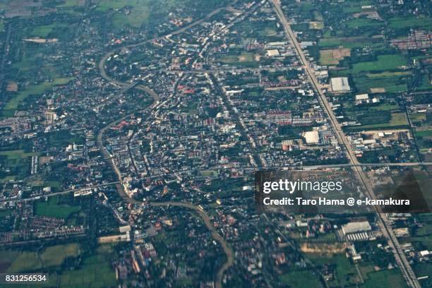 mueang suphan buri district in suphan buri province in thailand daytime aerial view from airplane - suphan buri province stock-fotos und bilder