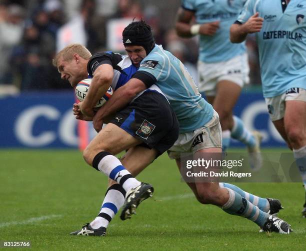 Michael Stephenson of Bath is tackled by Derrick Hougaard during the EDF Energy Cup match between Bath and Leicester Tigers at The Recreation Ground...