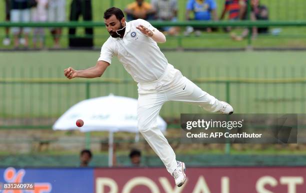 Indian cricketer Mohammed Shami drops a catch off Sri Lankan cricketer Lahiru Kumara during the third day of the third and final Test match between...