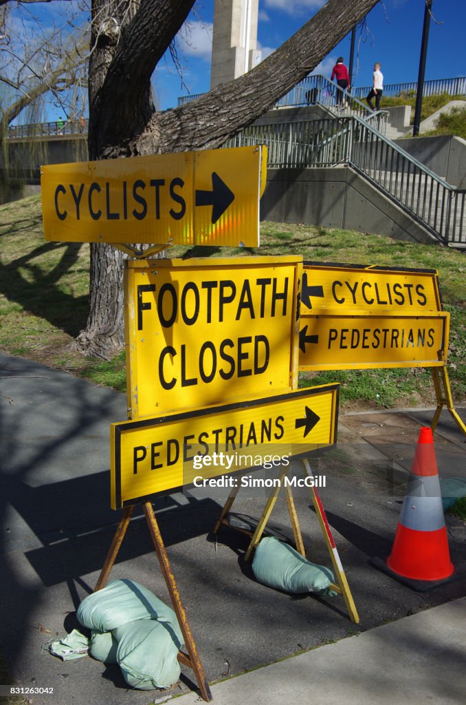 Signs indicating closed foot- and cycle-paths at Lake Burley Griffin near Commonwealth Avenue, Canberra, Australian Capital Territory, Australia
