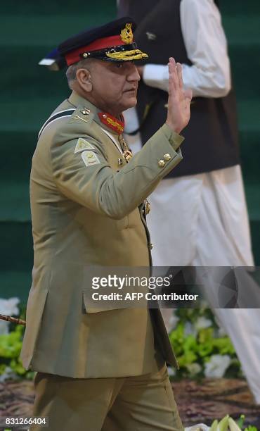 Pakistani Army Chief General Qamar Javed Bajwa arrives to attend a flag hoisting ceremony to mark the country's Independence Day in Islamabad on...