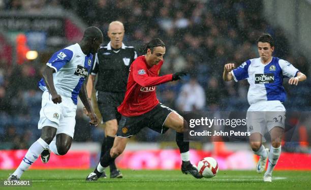 Dimitar Berbatov of Manchester United clashes with Christopher Samba and Matt Derbyshire of Blackburn Rovers during the FA Premier League match...