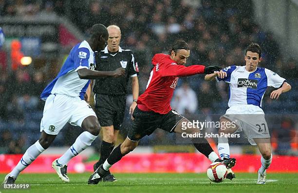 Dimitar Berbatov of Manchester United clashes with Christopher Samba and Matt Derbyshire of Blackburn Rovers during the FA Premier League match...
