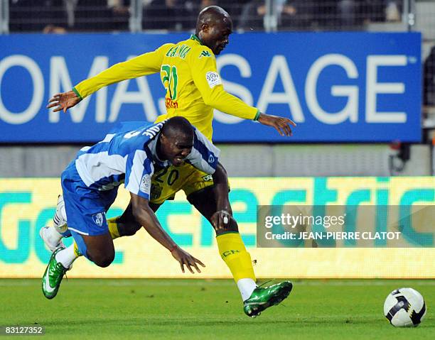 Grenoble's Franck Dja Dje Dje and Nantes's defender Aymard Bekamenga fight for the ball during the French L1 football match Grenoble vs Nantes, on...