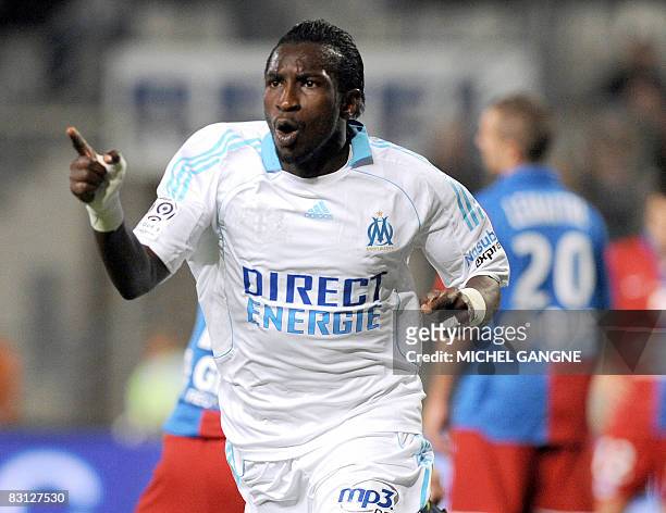 Marseille's forward Mamadou Niang jubilates after scoring a goal vs Caen, during the French L1 football match Marseille vs Caen on October 4, 2008 at...