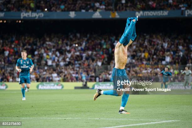 Cristiano Ronaldo of Real Madrid celebrates after scoring a goal during the Supercopa de Espana Final 1st Leg match between FC Barcelona and Real...