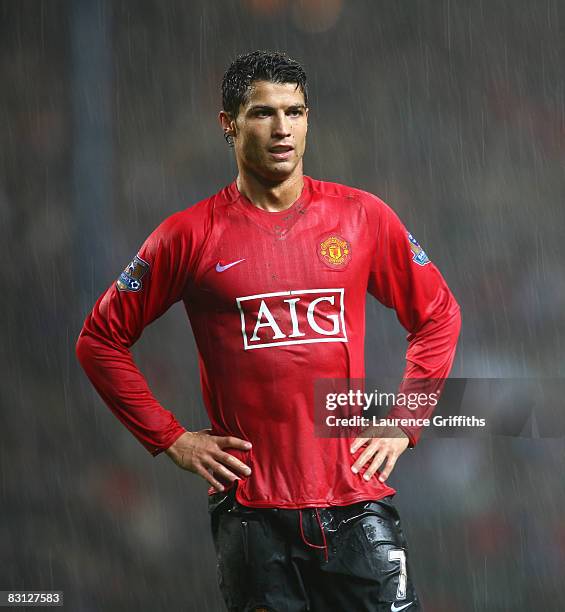 Cristiano Ronaldo of Manchester United looks on as the rain falls during the Barclays Premier League match between Blackburn Rovers and Manchester...